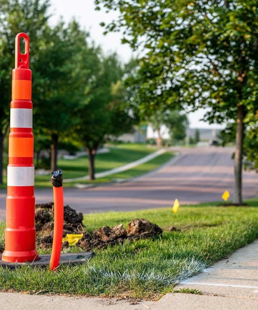cones and markers showing where a utility line is